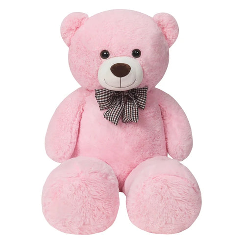 Pink teddy bear with a bow tie on a white background